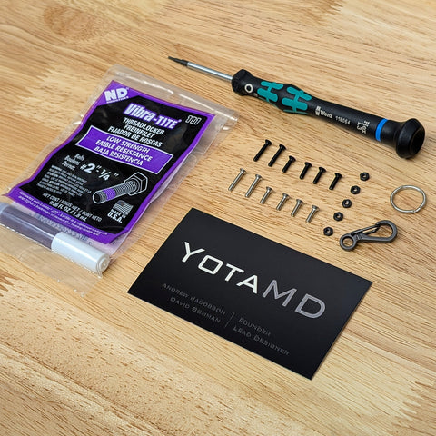 Image of all components included in this hardware kit: screws, nuts, key ring, clasp, driver, and threadlocker