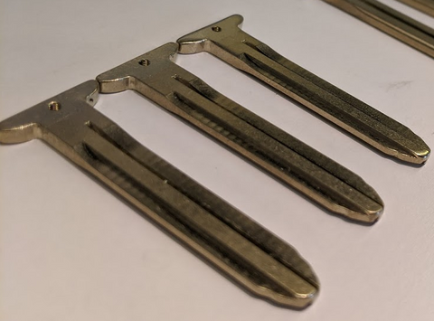 Angled view of 3 blank key blades for Toyota vehicles compatible with YotaMD YMD1 Key Kit