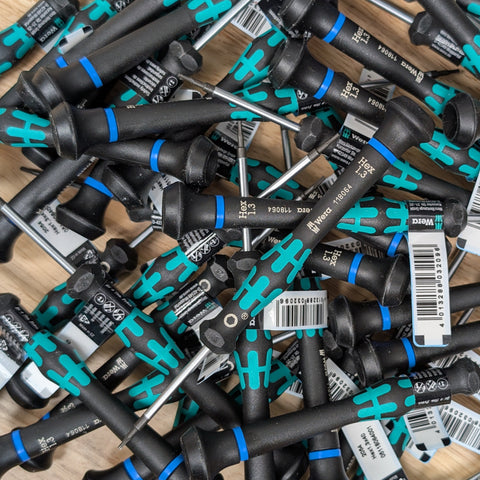 Many Wera Kraftform Micro 1.3mm screwdrivers shown in a pile
